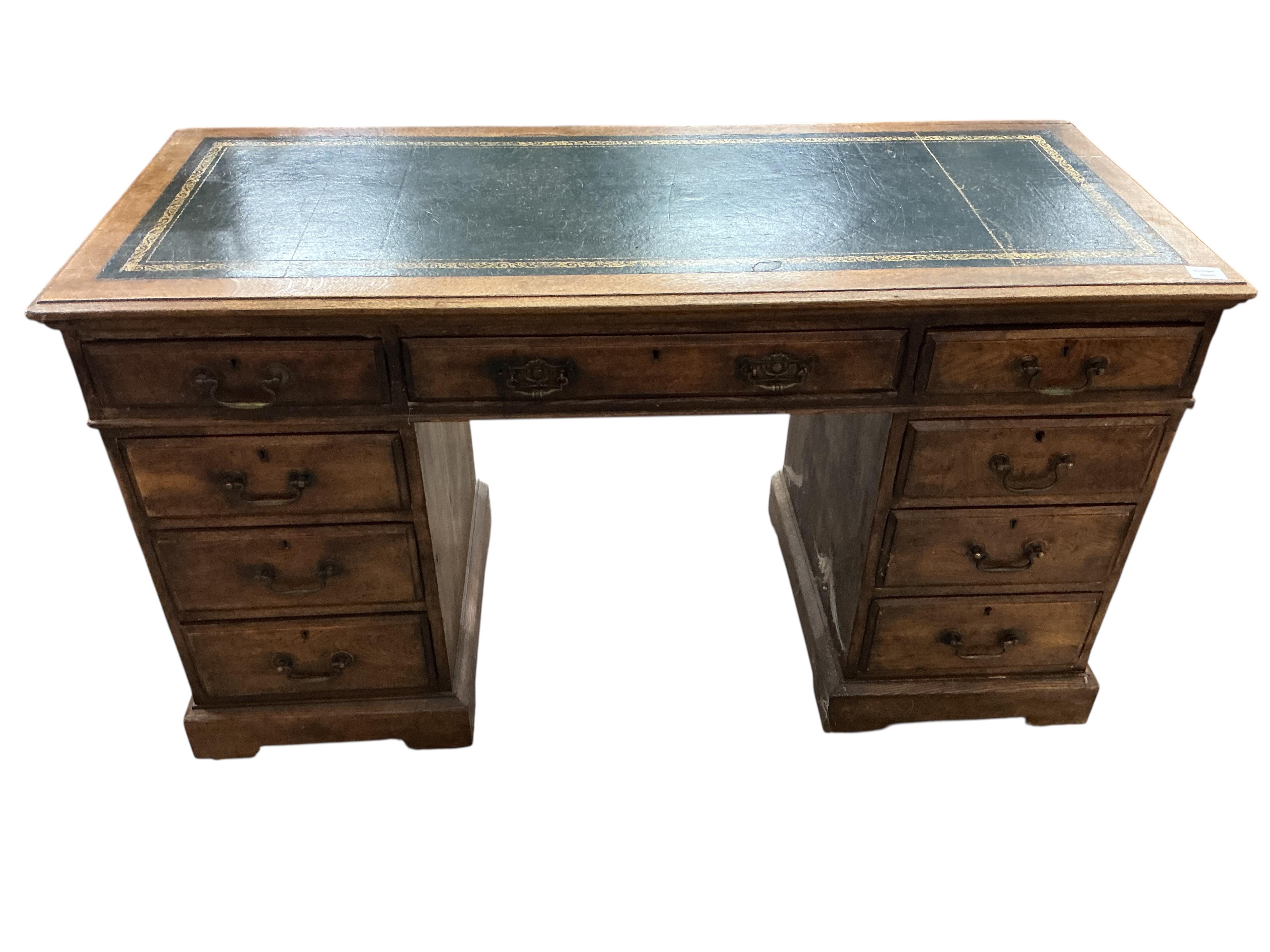 An early 20th century oak pedestal desk, width 138cm, depth 58cm, height 78cm
